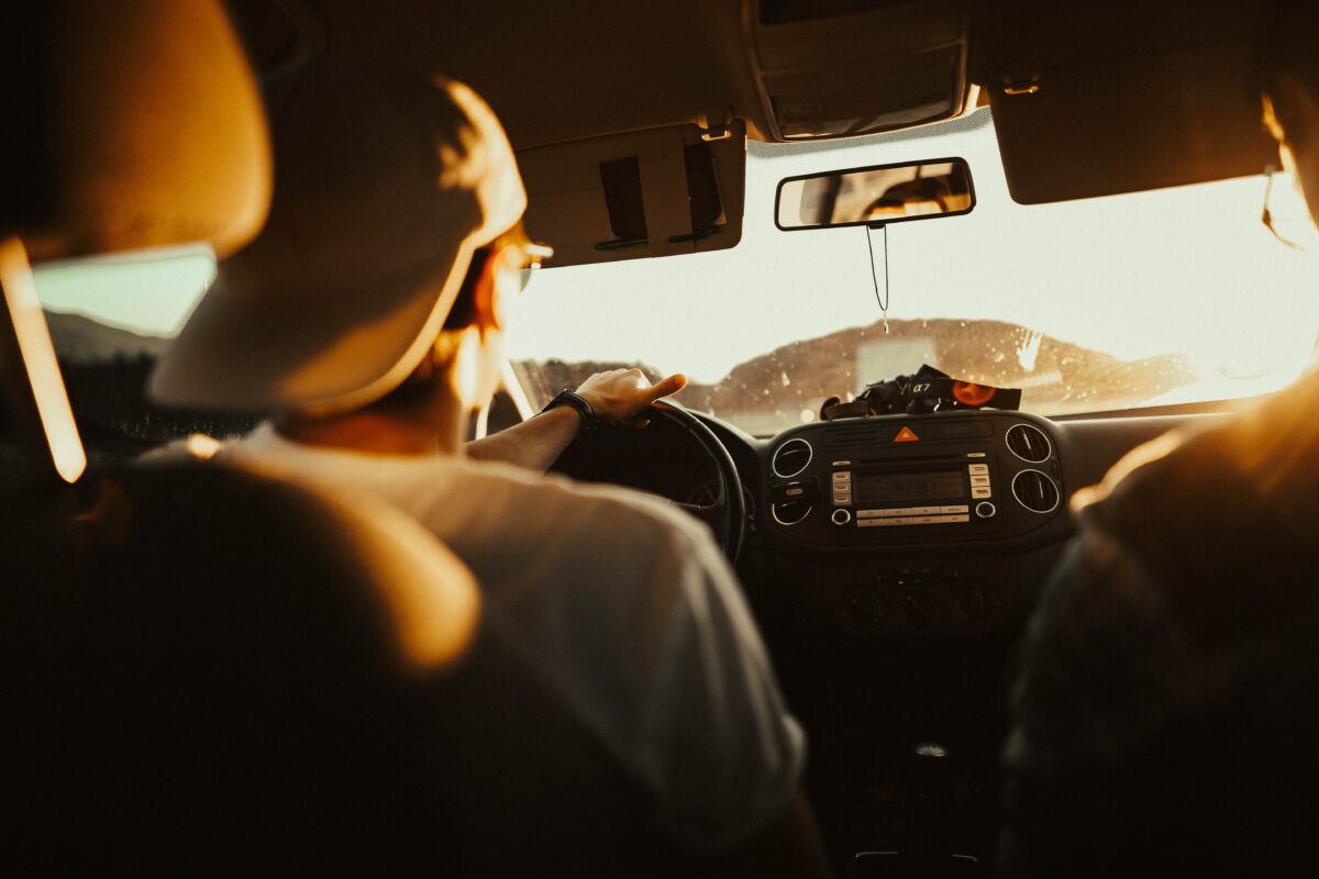 man driving car