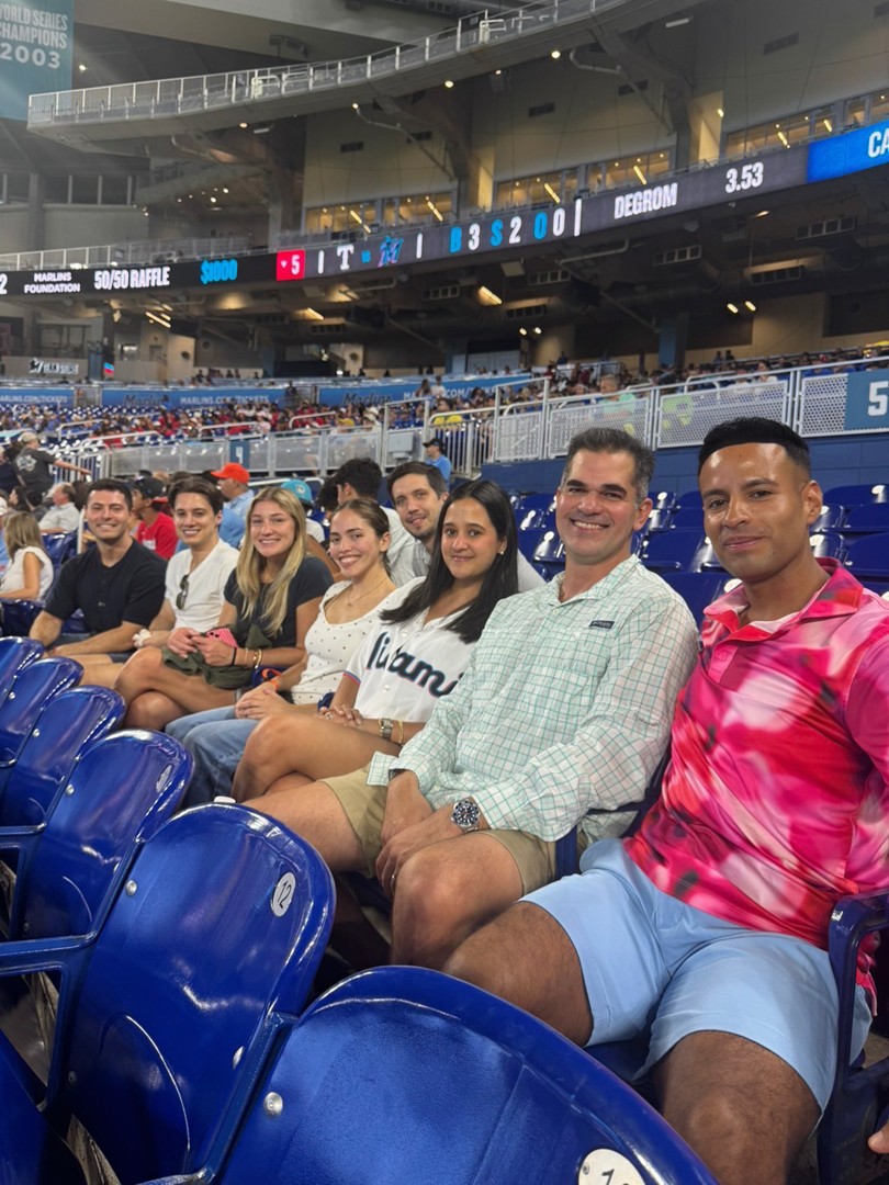 Ansbacher Law Coral Gables team attends Miami Marlins game at loanDepot park and appears on the jumbotron in Miami.